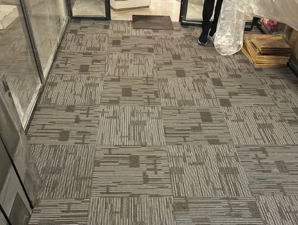 Open-plan office with premium carpet flooring installation in Dubai